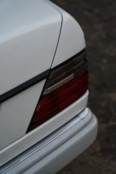 The back of a white car. The lantern of a white car in the evening Stock Photos