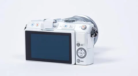 Back of a white Olympus E-PL6 with 40-150mm lens on white background Stock Photos