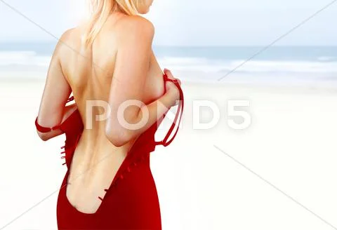Back of woman on shore l Stock Photos