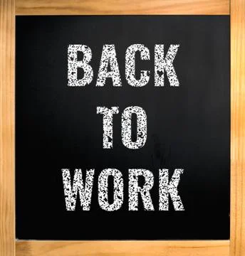 Back to work, chalk text over black board Stock Photos