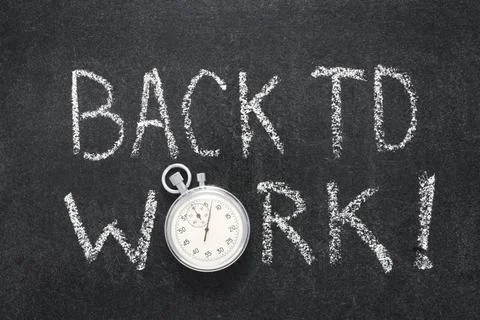 Back to work watch back to work phrase handwritten on chalkboard with vint... 写真素材