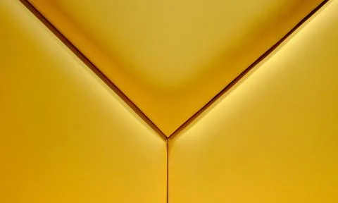 The back of a yellow sofa with three stripes in the form of a three-beam star Stock Photos