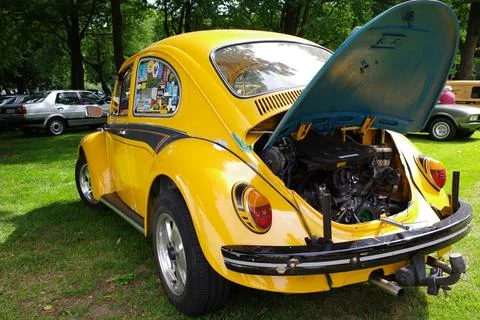 The back of a yellow VW beetle Stock Photos