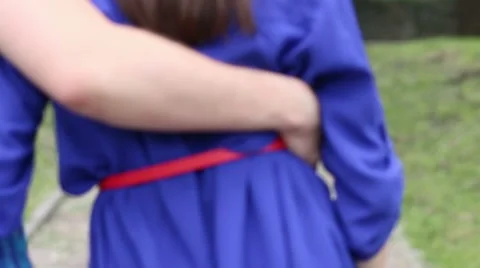 Back of young couple in blue walking at street at summer day Stock Footage 52452661