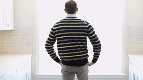 Back of young man walking in inspecting looking at house, apartment kitchen Stock Footage 92762506