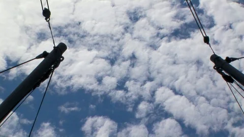 Back zoom from cloudy blue sky to ship’s spar Stock Footage 101561776
