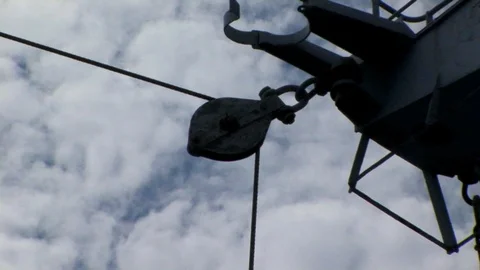 Back zoom from ship’s block and tackle to overview of ship’s spars Stock Footage 101561782