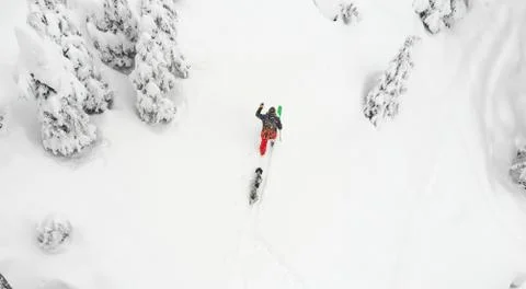 Backcountry Skier with his dog Stock Photos