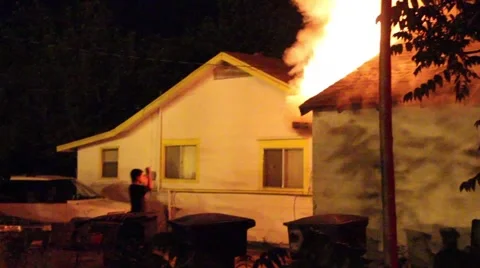 Backdraft scares off kid at house fire Stock Footage