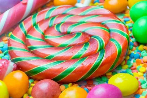 Backdrop from different colorful sweets and lollipops Stock Photos