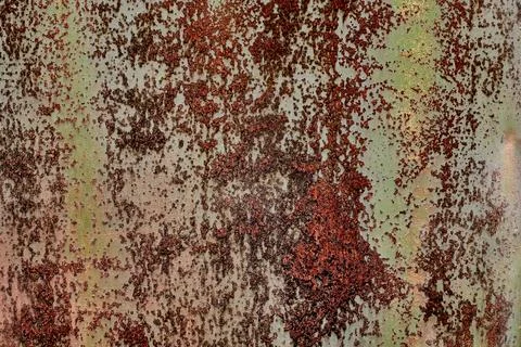 Backdrop of rusty surface of dark, brown, and orange hues. Detailed grunge Stock Photos