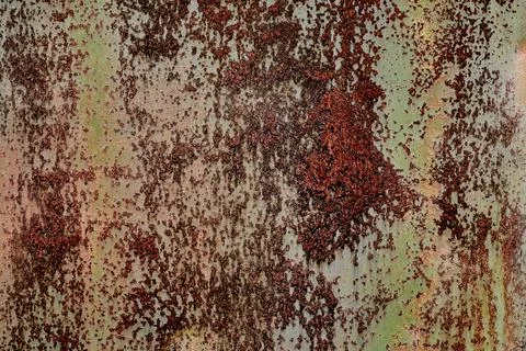 Backdrop of rusty surface of dark, brown, and orange hues. Detailed grunge Stock Photos