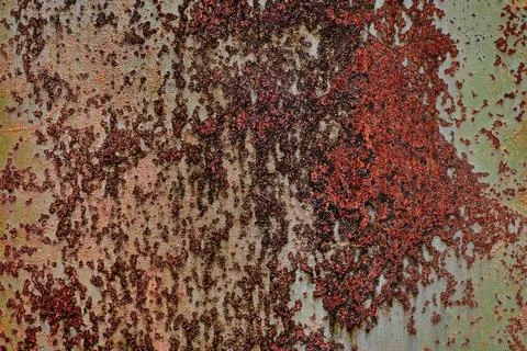 Backdrop of rusty surface of dark, brown, and orange hues. Detailed grunge Stock Photos