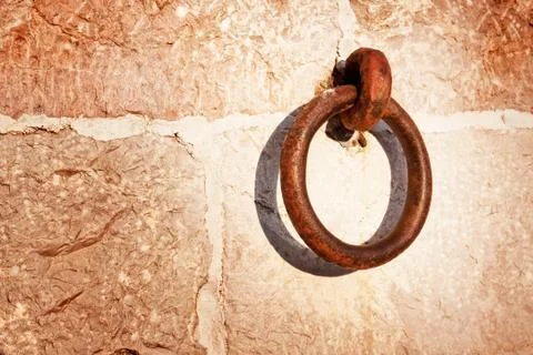 Backdrop of stone wall and rusty ring Stock Photos