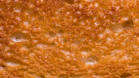 Backed breakfast toaster bread, textured background, stop motion Stock Footage 125363367