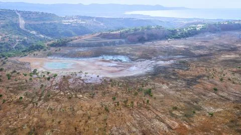 Backfilled open pit copper mine in Limni, Cyprus with colorful spots of  chem Stock Photos