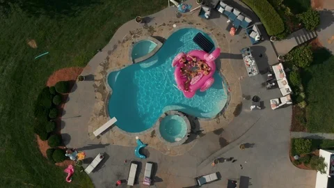 Backflip to swimming pool with pink inflatable flamingo Stock Footage 110912631
