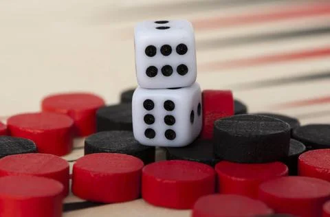 Backgammon and dices Black and red Backgammon and dices. Success conceptio... Stock Photos