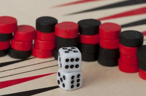 Backgammon and dices Black and red Backgammon and dices. Success conceptio... Stock Photos