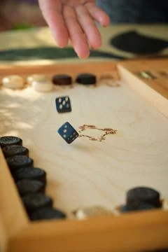 Backgammon board with chips and cubes in flight Stock-Fotos