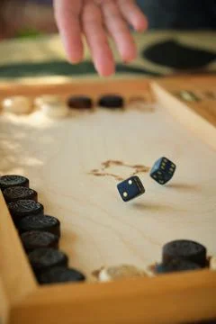 Backgammon board with chips and cubes in flight 스톡 사진