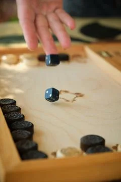 Backgammon board with chips and cubes in flight Stock Photos