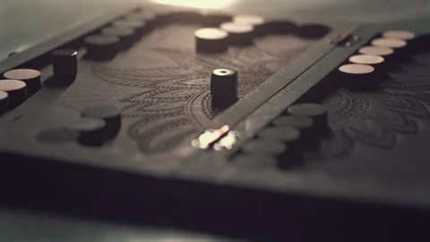 Backgammon board with dice landing in slow motion, dramatic and detailed view of Stock Footage 303645038