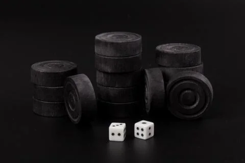 Backgammon. Board game. Black chips for playing on  black background. Game fo 写真素材