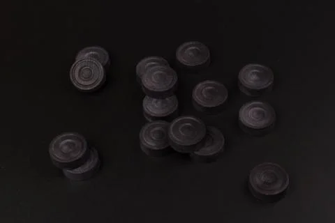 Backgammon. Board game. Black chips for playing on  black background. Game fo 写真素材