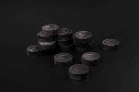 Backgammon. Board game. Black chips for playing on  black background. Game fo 写真素材