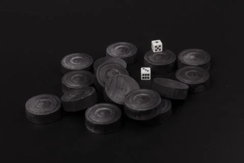 Backgammon. Board game. Black chips for playing on  black background. Game fo 写真素材