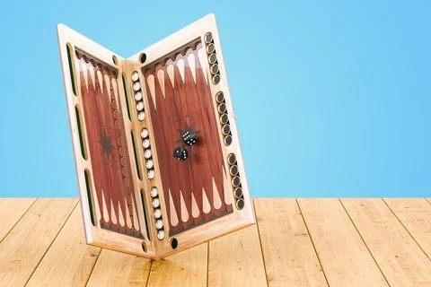 Backgammon, board game on the wooden table, 3D rendering Illustrazione stock