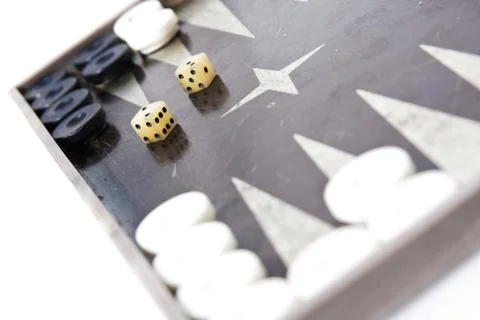 Backgammon dice and pieces isolated on white Stock Photos
