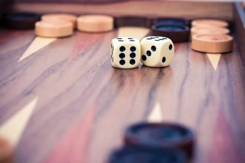 Backgammon with dices and chips Stock Photos