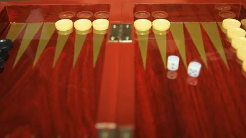 Backgammon game close-up. A man's hand throws game dice, dice Video stock 260634400