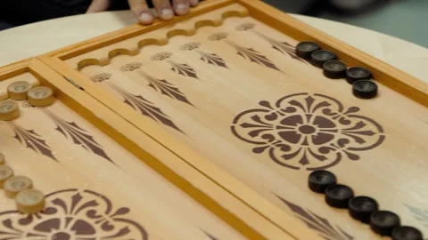 Backgammon game with dice and checkers on wooden board Stock Footage 318076065