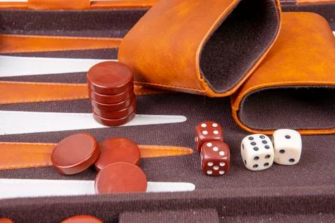 Backgammon game with dice and dice cup Stock Photos