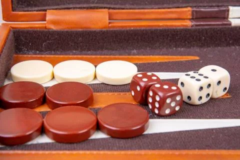 Backgammon game with dice and game pieces Stock Photos