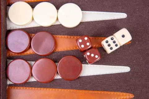 Backgammon game with dice and game pieces Stock Photos