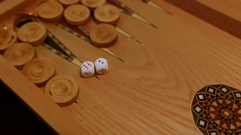 Backgammon Game Dice Rolling - Close-Up Shots of Two Dice Tumbling and Landing o Stock Footage 237634478