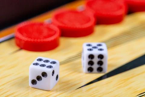 Backgammon game. Game dice lie on the backgammon board against the backgrou.. Stock Photos