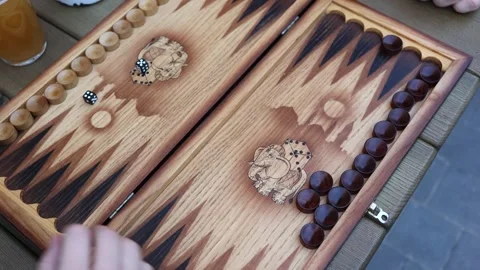 Backgammon game in progress at outdoor cafe Stock Footage 307231978
