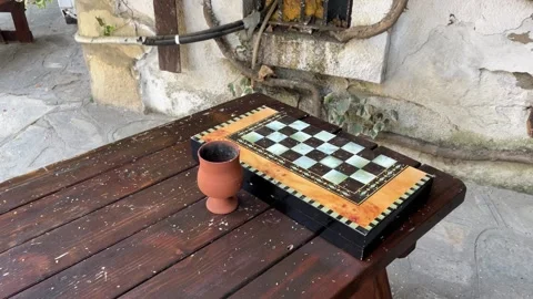 Backgammon set on a wooden table, rustic setting Stock Footage 278091673