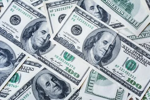 Background of 100 dollar bills. Texture US dollars. Concept of money, earning Foto stock
