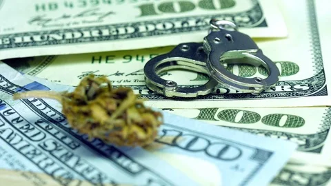 Background of 100 dollars, marijuana , handcuffs Stock Footage 123830114