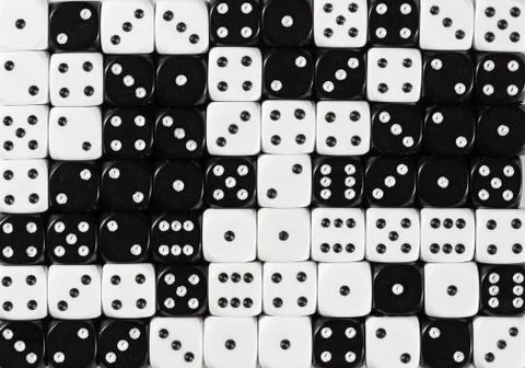 Background of 70 random ordered black and white dices Stock Photos
