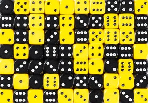 Background of 70 random ordered black and yellow dices Stock Photos