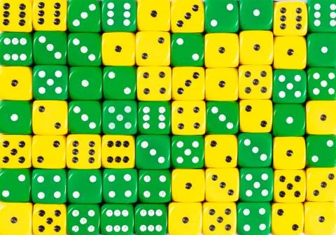 Background of 70 random ordered yellow and green dices Stock Photos