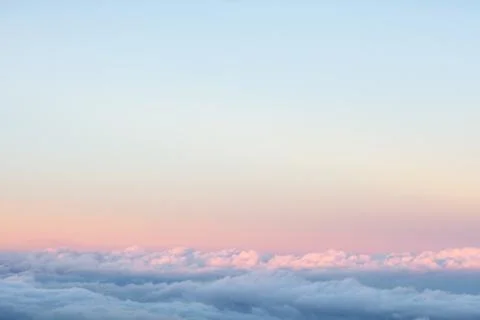 Background: above the clouds on beautiful sunset sky 스톡 사진