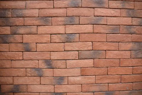 Background for the ad text is made of brick wall. Stockfoto's